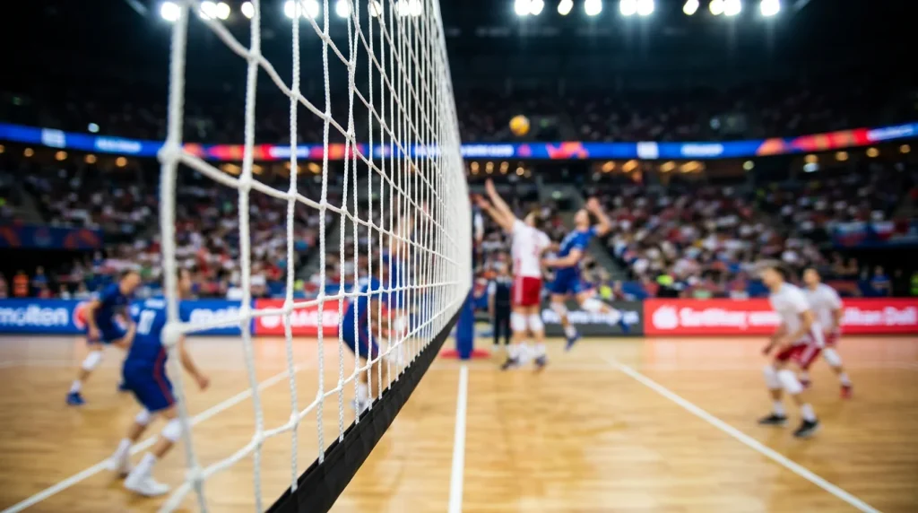 Rede de voleibol em primeiro plano com jogadores desfocados durante um jogo